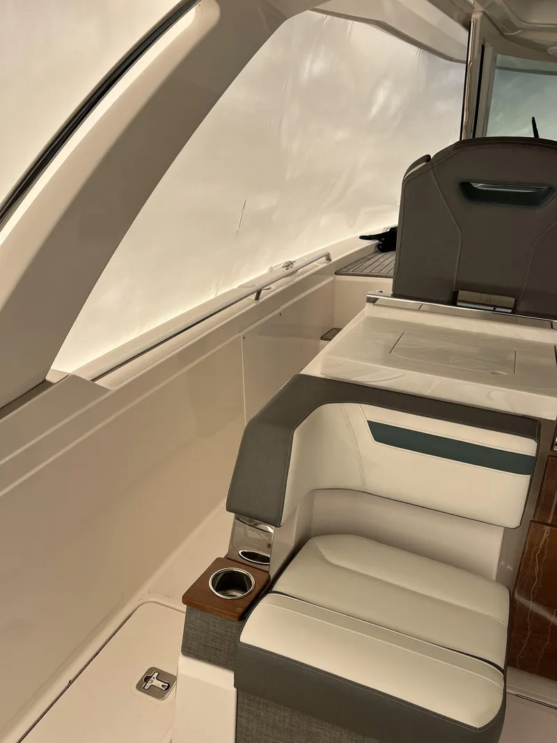 Slide: The Image of 2019 Tiara Sport 38 interior with sleek seating and modern design. - 26