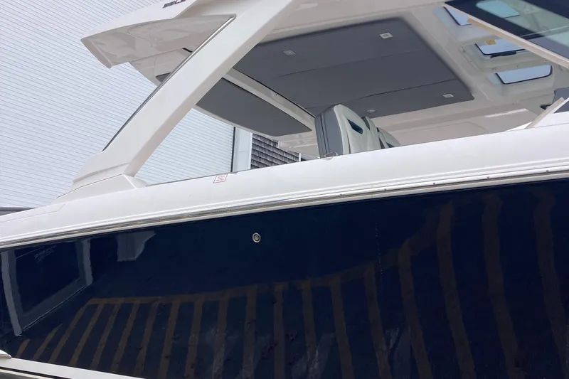 Slide: The Image of 2019 Tiara Sport 38 boat exterior view with sleek design. - 3