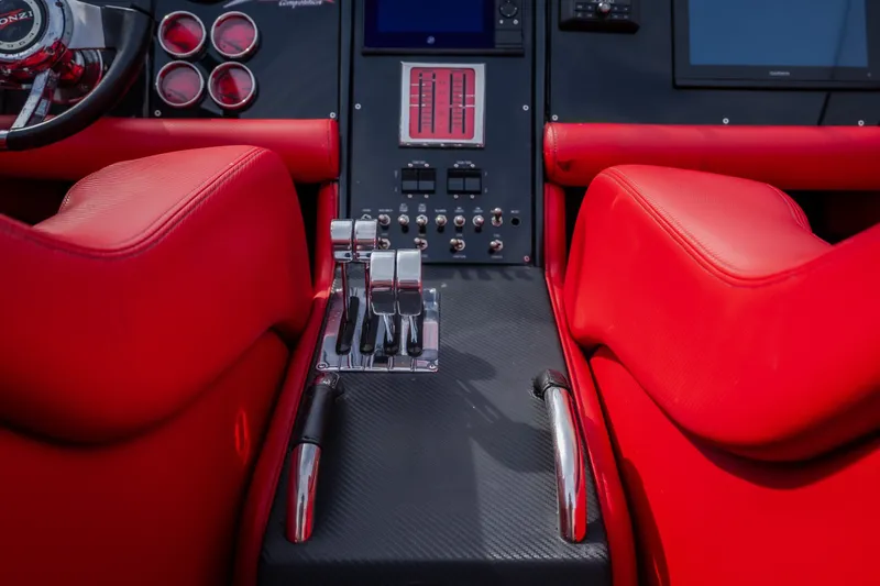 Slide: The Image of Interior of 2009 Donzi 38 ZRC boat with red seats and control panel. - 40