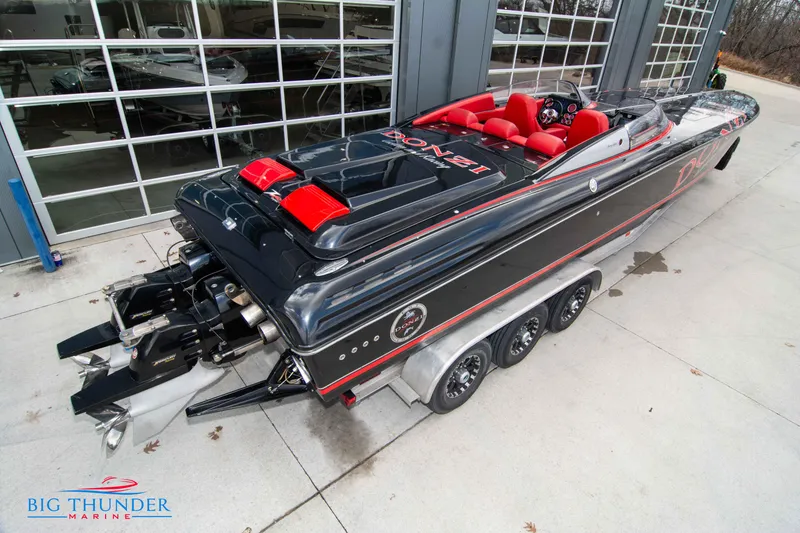 Slide: The Image of 2009 Donzi 38 ZRC speedboat with red interior, displayed at Big Thunder Marine. - 10