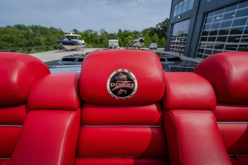 Slide: The Image of Red leather seats of a 2009 Donzi 38 ZRC boat with logo emblem. - 36