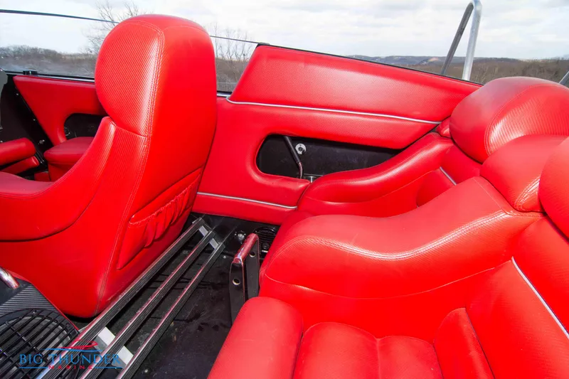 Slide: The Image of Interior of 2009 Donzi 38 ZRC with vibrant red leather seats. - 22
