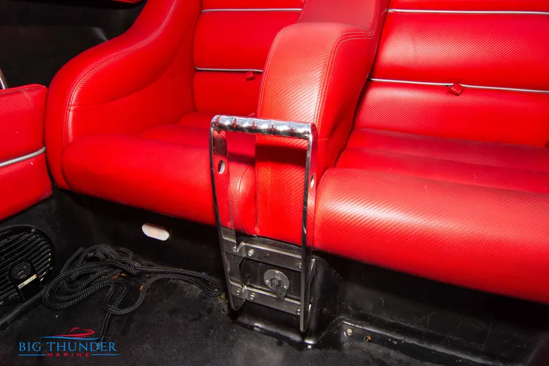 Slide: The Image of Red leather interior of a 2009 Donzi 38 ZRC boat with chrome accents. - 26
