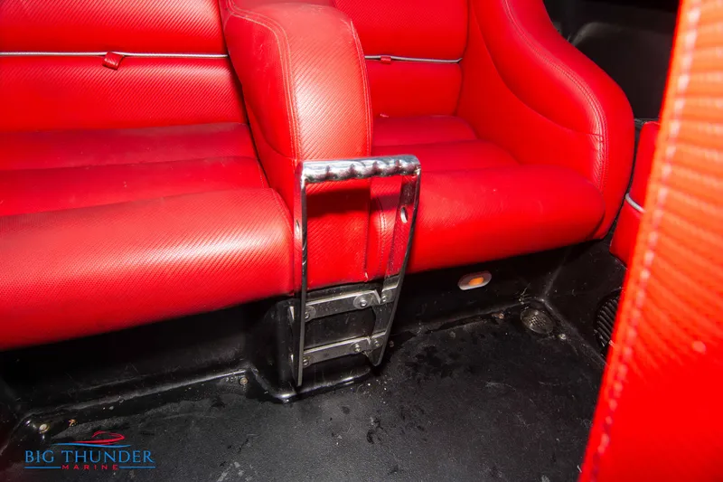 Slide: The Image of 2009 Donzi 38 ZRC red leather interior with chrome accents. - 27