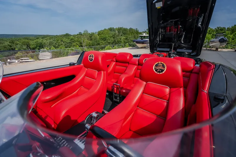 Slide: The Image of Red leather interior of 2009 Donzi 38 ZRC boat, showcasing luxurious seating and sleek design. - 27