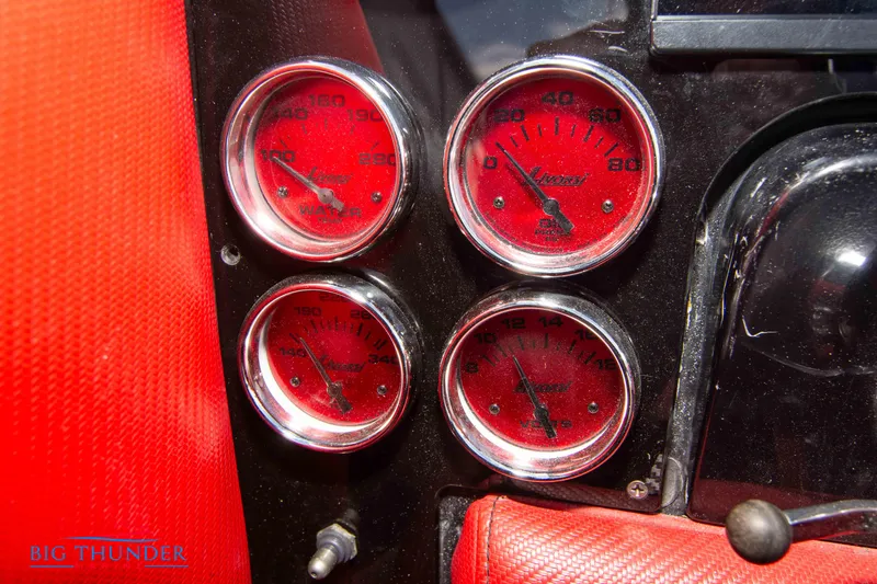 Slide: The Image of Close-up of 2009 Donzi 38 ZRC boat's red dashboard gauges. - 33