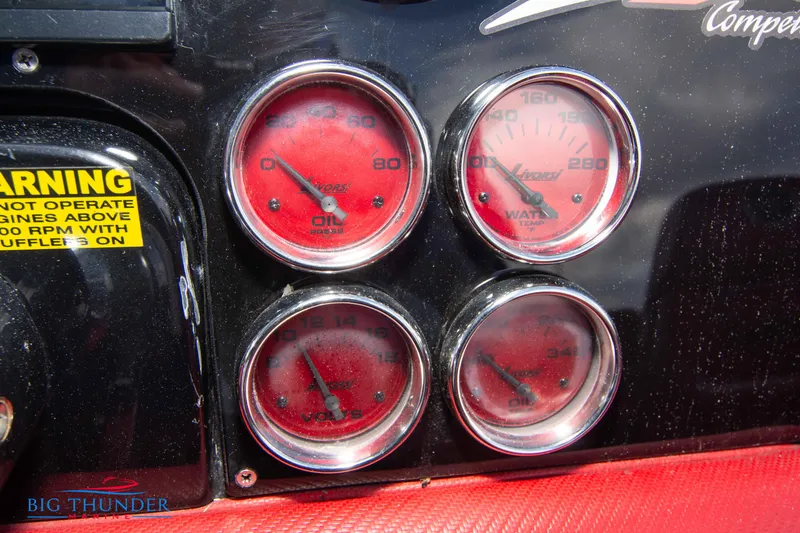 Slide: The Image of Close-up of 2009 Donzi 38 ZRC dashboard gauges and warning label. - 35