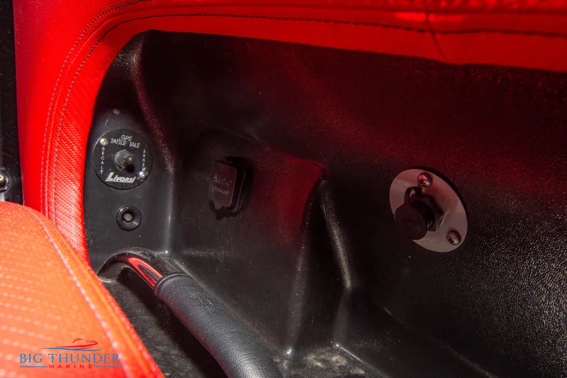 Slide: The Image of Close-up of the interior controls of a 2009 Donzi 38 ZRC boat. - 44