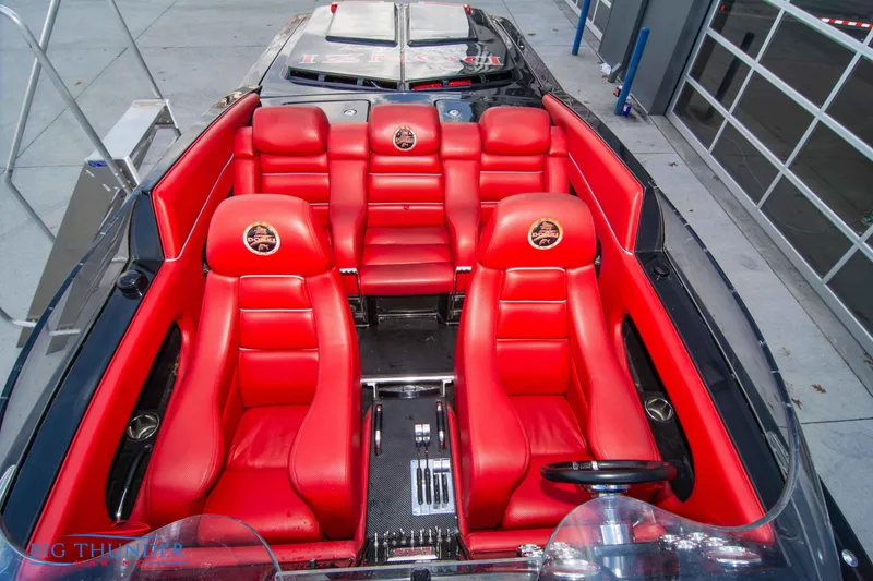 Slide: The Image of 2009 Donzi 38 ZRC boat with vibrant red leather seats and sleek design. - 45