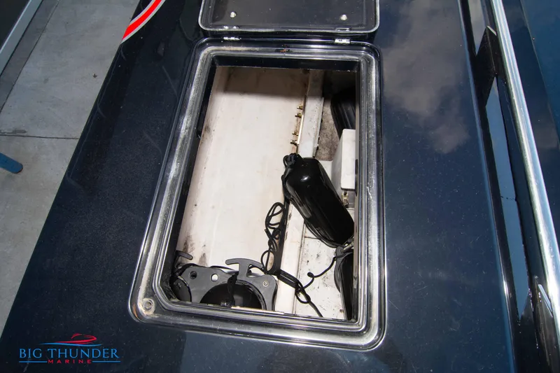 Slide: The Image of 2009 Donzi 38 ZRC storage compartment with equipment. - 49