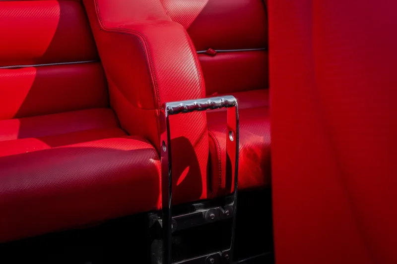Slide: The Image of Red leather interior of 2009 Donzi 38 ZRC boat with chrome accents. - 29