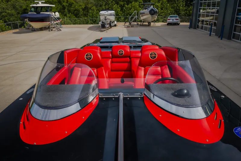 Slide: The Image of 2009 Donzi 38 ZRC speedboat with vibrant red seating and sleek design. - 21