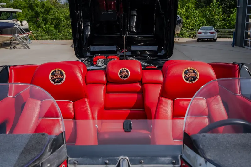 Slide: The Image of Red leather interior of a 2009 Donzi 38 ZRC boat with logo on seats. - 51