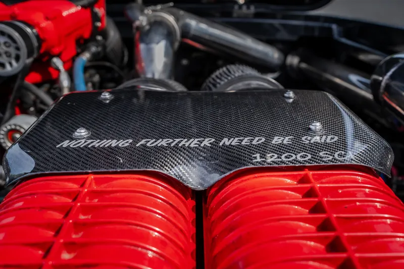 Slide: The Image of Close-up of 2009 Donzi 38 ZRC engine with "Nothing Further Need Be Said" text. - 46