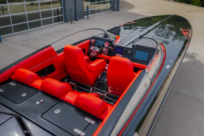 Slide: The Image of 2009 Donzi 38 ZRC speedboat with vibrant red interior and sleek design. - 34