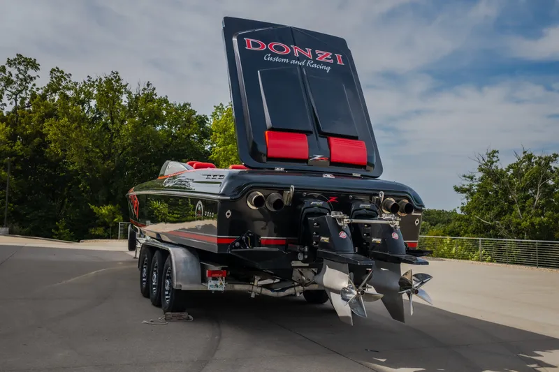 Slide: The Image of 2009 Donzi 38 ZRC speedboat on trailer, rear view with raised engine cover. - 22