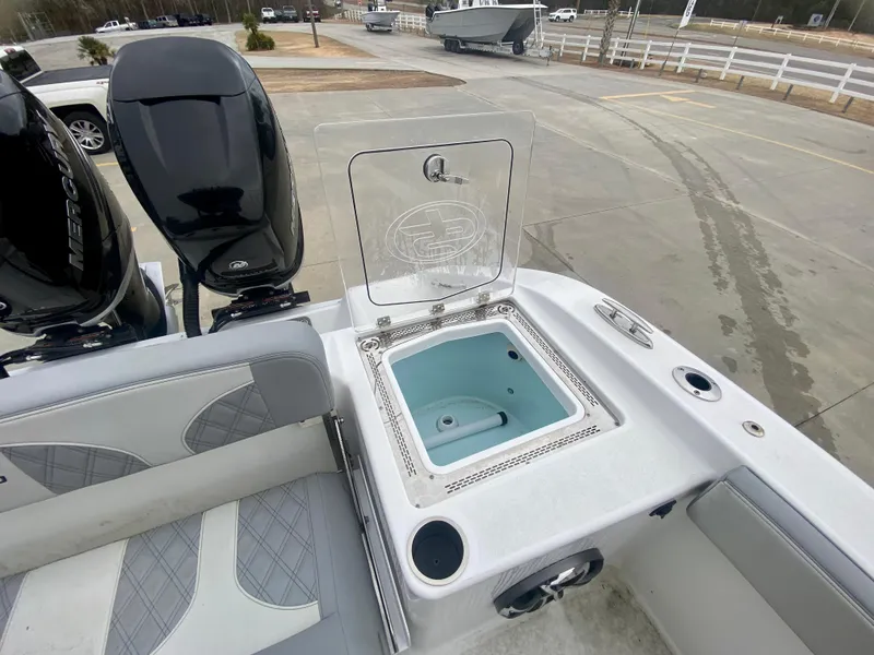 Slide: The Image of 2022 Sea Pro 320 DXL boat with open livewell and twin outboard motors. - 10
