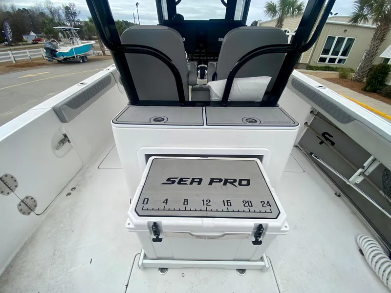 Slide: The Image of 2022 Sea Pro 320 DXL boat interior with seating and storage. - 12