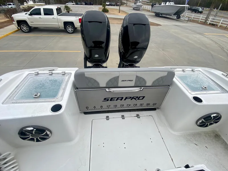 Slide: The Image of 2022 Sea Pro 320 DXL boat with dual outboard engines and spacious deck. - 7