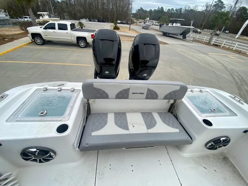 Slide: The Image of 2022 Sea Pro 320 DXL boat with dual outboard motors and rear seating. - 8