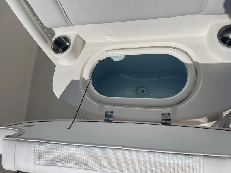 Slide: The Image of 2024 Sea Born SX239 Offshore boat livewell and seating area. - 11