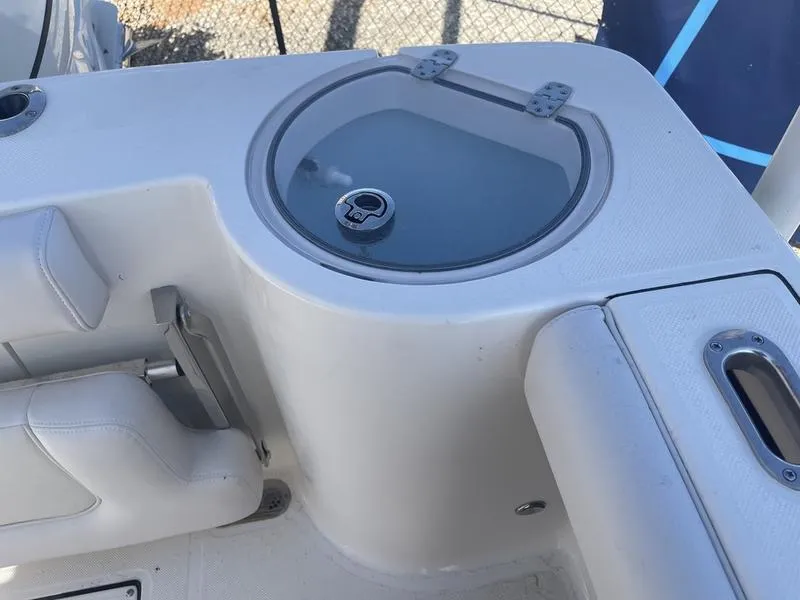 Slide: The Image of 2024 Sea Born SX239 Offshore boat interior with seating and storage compartment. - 12