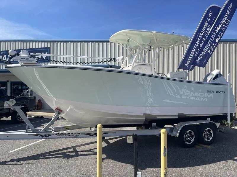 Slide: The Image of 2024 Sea Born SX239 Offshore boat on trailer outside dealership. - 3