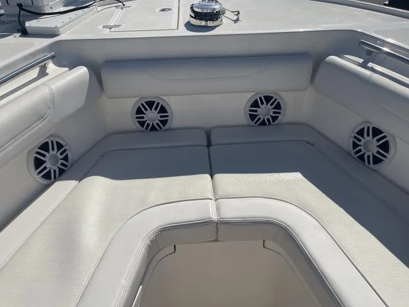 Slide: The Image of 2024 Sea Born SX239 Offshore boat interior seating with built-in speakers. - 6