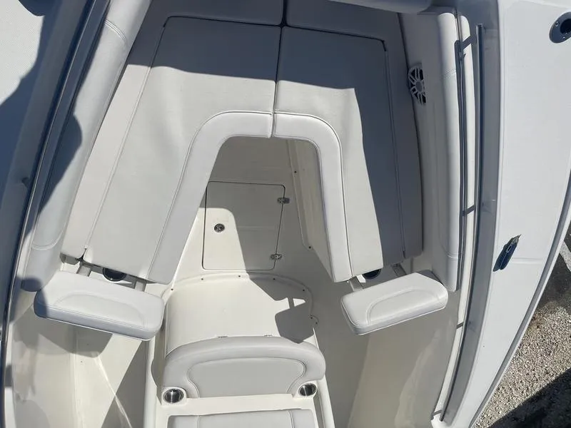 Slide: The Image of 2024 Sea Born SX239 Offshore boat interior seating area. - 7