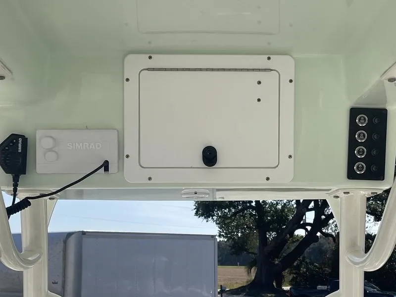 Slide: The Image of 2024 Sea Born SX239 Offshore boat console with Simrad electronics and control panel. - 9