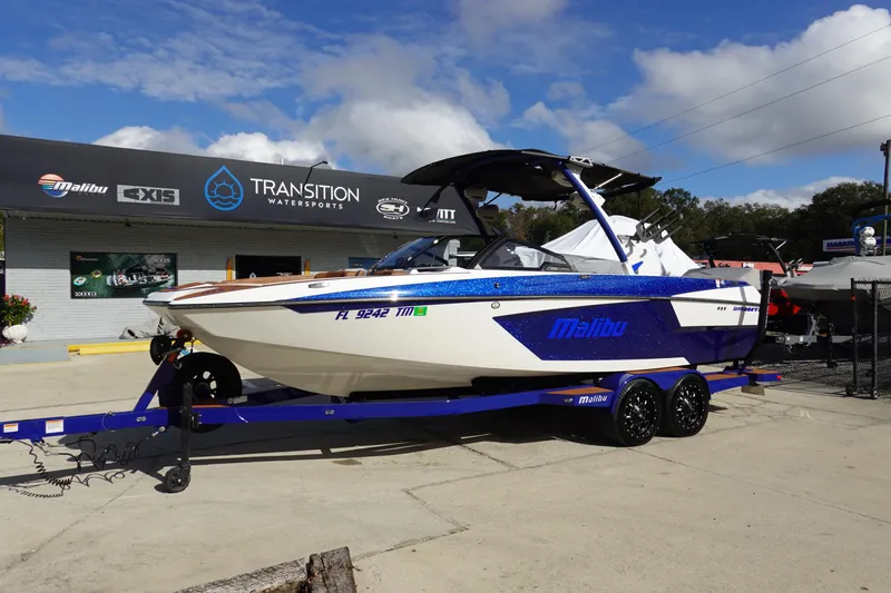Slide: The Image of 2023 Malibu Wakesetter 24 MXZ boat on a trailer at Transition Watersports. - 1
