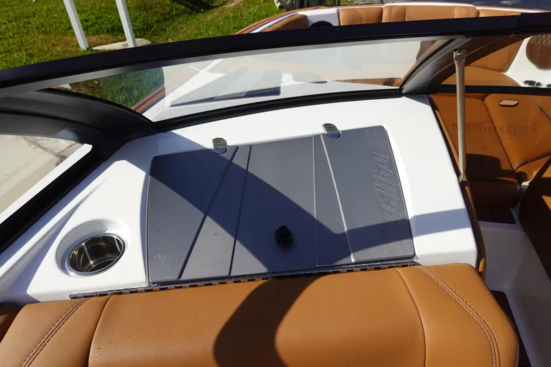 Slide: The Image of 2023 Malibu Wakesetter 24 MXZ interior dashboard and seating area. - 14