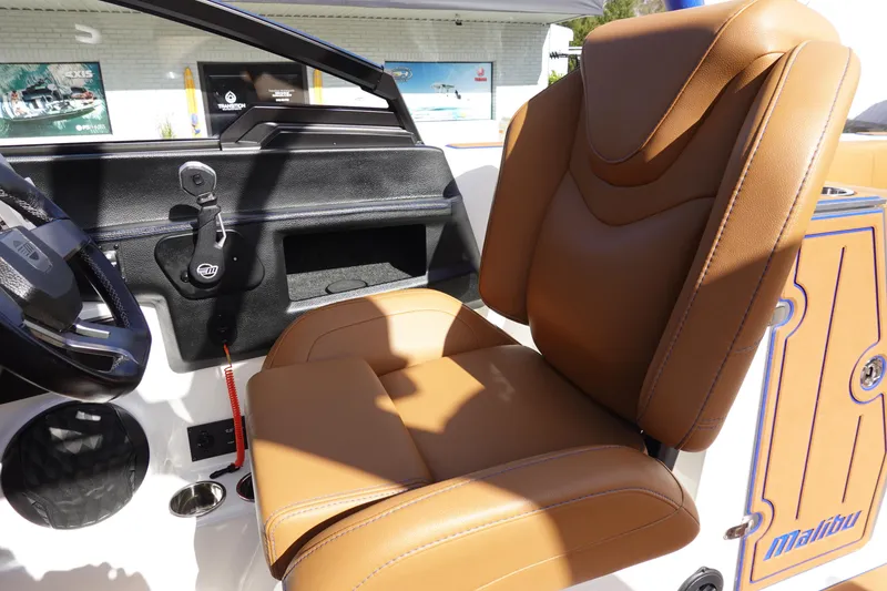 Slide: The Image of 2023 Malibu Wakesetter 24 MXZ interior with tan leather captain's seat. - 20