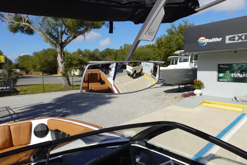 Slide: The Image of 2023 Malibu Wakesetter 24 MXZ boat interior with rearview mirror reflection. - 34