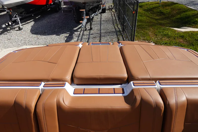 Slide: The Image of 2023 Malibu Wakesetter 24 MXZ rear seating area with brown upholstery. - 37