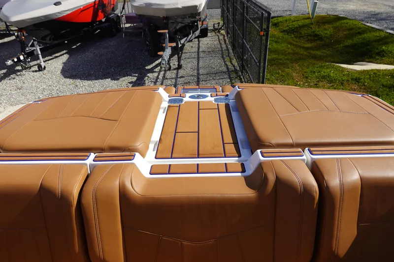 Slide: The Image of 2023 Malibu Wakesetter 24 MXZ boat with tan upholstery and swim platform. - 38