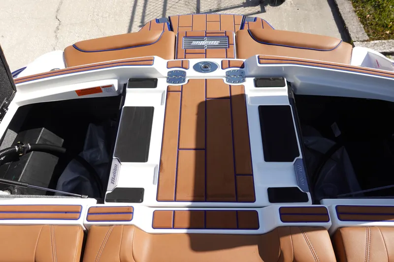 Slide: The Image of 2023 Malibu Wakesetter 24 MXZ boat deck with brown and white detailing. - 39