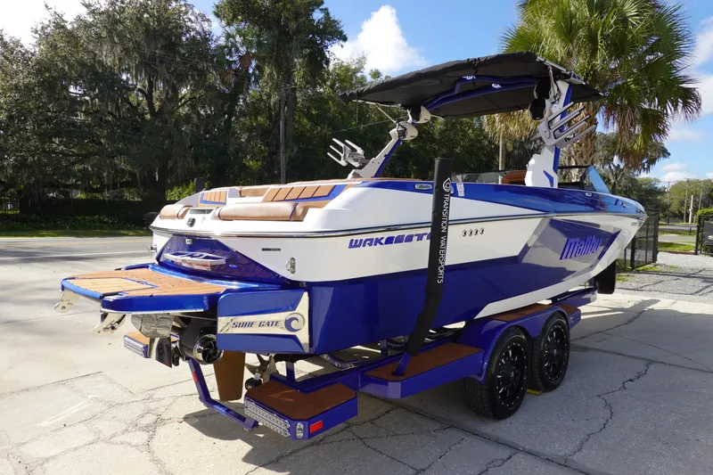 Slide: The Image of 2023 Malibu Wakesetter 24 MXZ boat on trailer, rear view. - 4
