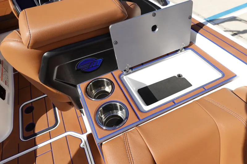 Slide: The Image of 2023 Malibu Wakesetter 24 MXZ interior with cup holders and storage compartment. - 41