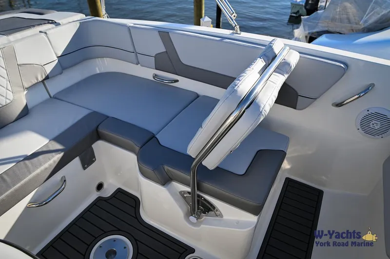 Slide: The Image of 2024 Bayliner VR5 boat interior with cushioned seating and modern design. - 11