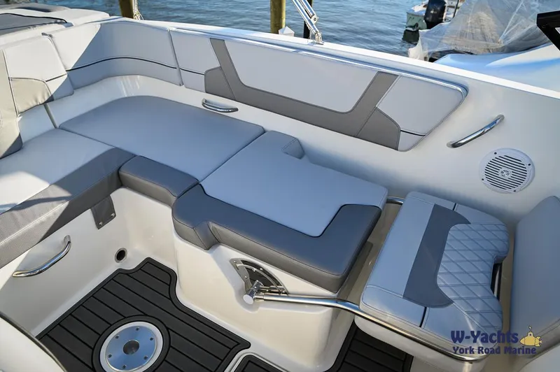 Slide: The Image of 2024 Bayliner VR5 boat interior with cushioned seating and modern design. - 12