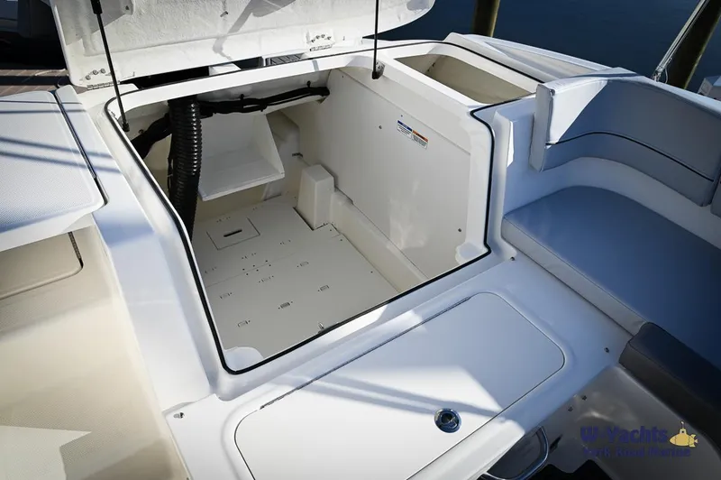 Slide: The Image of 2024 Bayliner VR5 boat storage compartment with open hatch. - 15