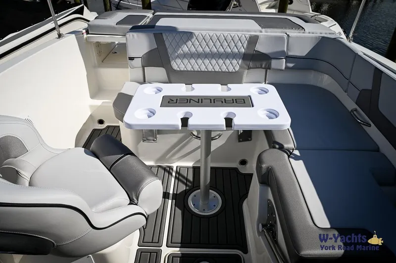 Slide: The Image of 2024 Bayliner VR5 boat interior with seating and table. - 22