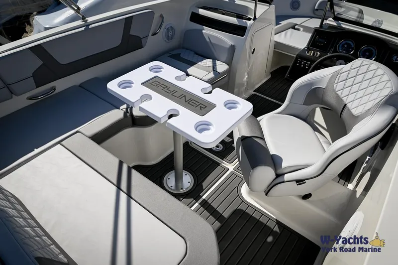 Slide: The Image of 2024 Bayliner VR5 boat interior with seating and table. - 23