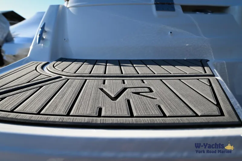 Slide: The Image of 2024 Bayliner VR5 boat deck with VR logo and non-slip mat. - 27