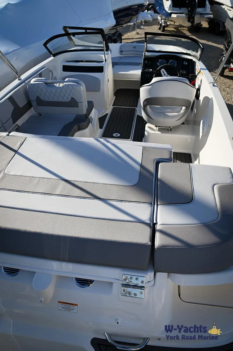 Slide: The Image of 2024 Bayliner VR5 boat interior with seating and steering console. - 29