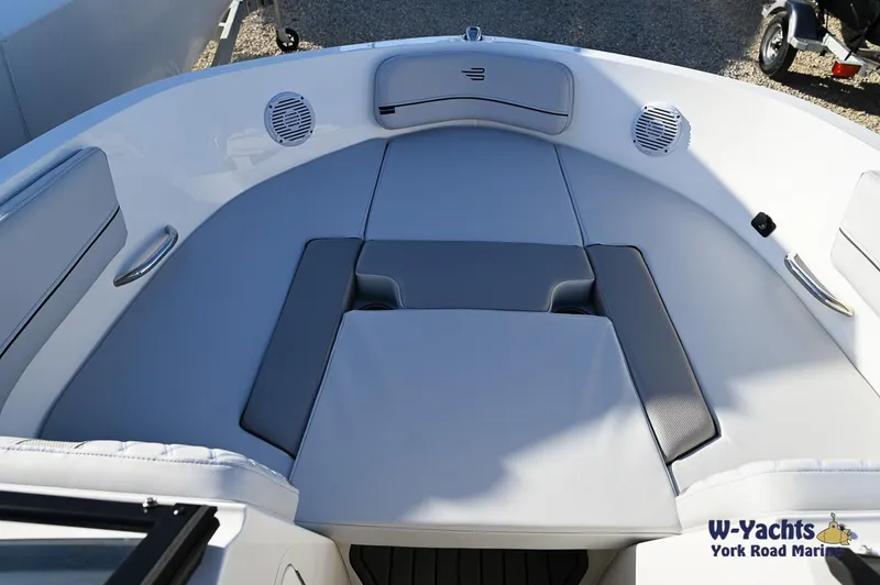 Slide: The Image of 2024 Bayliner VR5 boat bow seating area with cushions and speakers. - 3