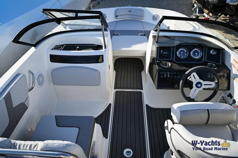 Slide: The Image of 2024 Bayliner VR5 boat cockpit with modern dashboard and seating. - 8
