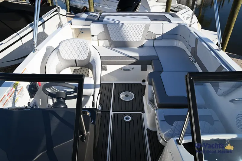 Slide: The Image of 2024 Bayliner VR5 boat interior with modern seating and steering wheel. - 9