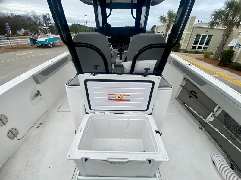 Slide: The Image of 2022 Sea Pro 320 DXL boat interior with open storage compartment. - 13